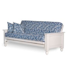 a blue and white couch with two pillows on it's armrests, sitting in front of a white background