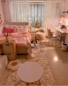 a bedroom with white curtains and pink bedding