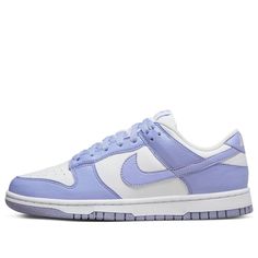 Take a step back in time while freeing the environment from some of its human-caused burden with the Nike Dunk Low Next Nature Lilac Women. Crafted with 20% recycled materials, these eye-catching shoes provide an inspiring take on retro style. The upper is designed using white leather and punctuated with perforated toe box for added breathability. Violet hues appear throughout, tinting the overlays and laces as well as adding a subtly branded touch via a purple Nike label on the tongue. To complete the look, the heel has an embroidered white Nike logo and volt insole sets off a black pinwheel against the white rubber midsole. This eco-friendly masterpiece comes together with a stunning purple Grind outsole—an inimitable combination of athletic style and sustainable design. With fashion tre Nike Dunk Low Next Nature, Preppy Shoes, Purple Nikes, Cute Nike Shoes, Purple Shoes, Cute Nikes, July 2022, Swag Shoes, School Shoes