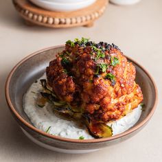 a bowl with some food in it on a table