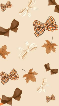 several bows and leaves on a beige background