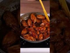 a pan filled with food sitting on top of a stove