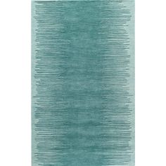 a blue rug with wavy lines on the top and bottom, in shades of teal