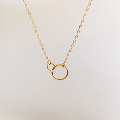 Some things are for the here and now, and some things are forever.  This dainty necklace is crafted with interlocking open rings to symbolize your lasting connection with a loved one.    It's  perfect for gifting someone you care about. ✤available in 14k gold filled ✤chain link: flattened cable ✤ available lengths: 14",16" and 18" SHIPPING: ✤I offer FREE shipping within Canada but please note that this does NOT include tracking.  If you choose FREE shipping, you risk your package getting lost in Eternity Necklace, Necklace Friendship, Friendship Necklace, Open Rings, Gold Filled Necklace, Friendship Necklaces, Dainty Gold Necklace, Ring Pendant, Gold Necklace Layered