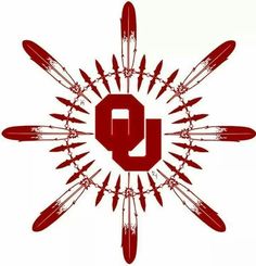 the letter q is surrounded by spikes and arrows in red on a white background with black lettering