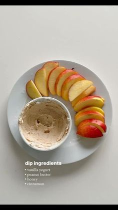 an apple slices and dip on a white plate