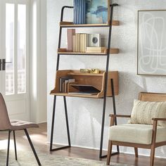 a room with a chair, desk and bookshelf