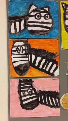 three paintings of zebra shoes on a wall