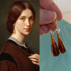 "Faux Brown TORTOISE Shell TEARDROP Earrings, Regency, 16k Gold plated Loops, reproduction historic, faux Tortoise shell Teardrops These gorgeous brown (flecked) faux TORTOISESHELL Teardrop and glass Pearl earrings were inspired by extant examples of the era! Designed with Victorian (mid to late 19th century) and Regency (1800-1815) and late Regency/Romantic (into the 1830's) in mind, but also work great for other eras. This listing is for a pair of reproduction historic FAUX Tortoiseshell made Vintage Brown Drop Earrings, Brown Teardrop Earrings For Formal Occasions, Formal Brown Teardrop Earrings, Vintage Brown Teardrop Earrings, Elegant Tortoiseshell Drop Earrings, Historical Earrings, Old Earrings, Tortoise Earrings, Victorian Earrings