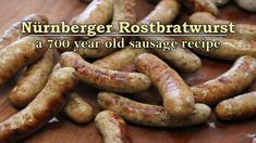 several sausages on a wooden table with the words nurberer rotitatwurst