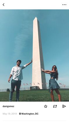 a man and woman standing in front of the washington monument with their arms around each other