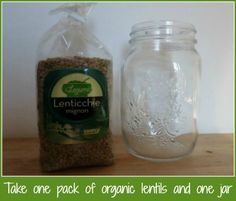 there is a jar with some seeds in it next to a bag of organic lentils and one jar