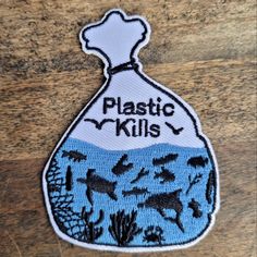 a patch that says plastic kills in front of a bag filled with seaweed and other marine life