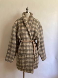 1980s Wayne Stuart mohair large herringbone print cocoon style coat with two large patch pockets and shawl collar has no closures; to be worn open, or create your style with a belt or snaps. Fully lined in acetate, in excellent vintage condition. Shoulders 22" across Chest 50"(25" across, doubled) Waist 48" Hem 52" Arm length from neck to cuff 29", from shoulder to cuff 21.5" Length from back of neck to hem 34" Style Coat, Oversized Coat, Shawl Collar, Herringbone, Jackets & Coats, Jackets For Women, Collar, Clothes For Women, Grey