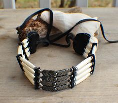 "Native American Made 4 Strand Choker w/ Hematite William Lattie / Cherokee / Welling, OK. / comes w/ Certificate of Authenticity Choker is 12\" length not including ties. Black Deer Leather ties are 10\" length. We have used White Bone hairpipe sizes 1/2\", 1\", & 1 1/2\" along with Hematite 6 mm rounds and Hematite Chevrons. We make our own spacers and ends of Black Deer Leather. Be sure to check out our Native Bracelet Category, many of our chokers will have matching bracelets. If you hav Native American Jewelry Diy, Black Statue Of Liberty, Black Deer, Eagle Necklace, American Indian Jewelry, Bead Loom Bracelets, Native Jewelry, Bead Loom, Loom Bracelets