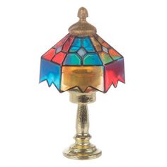 a colorful lamp sitting on top of a table