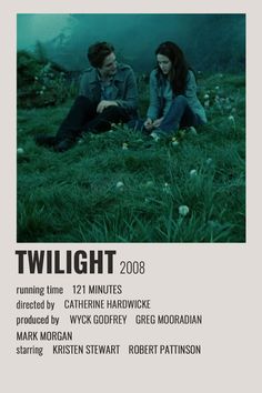 the twilight movie poster with two people sitting on grass