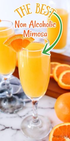 the best non alcoholic mimosa recipe is in two glasses with orange slices around them