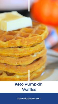 a stack of waffles with butter on top and the words keto pumpkin waffles