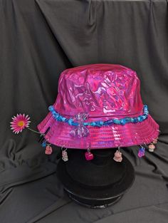 -hat color - pink -bead color -blue -charm color - blue and pink -unisex adult size -inner circumference - 22.5in -crown dip - 3in -brim - 2.25in -NOT machine washable -Perfect for raves and outdoor festivals! Shipping within the US USPS First Class Package 3-9 days USPS Priority Mail 1-5 days USPS Priority Mail Express 1-3 days Shipping International  USPS First Class Mail International  -Varies- USPS Priority Mail International 6-14 days USPS Priority Mail Express International 3-9 days Shipping times are estimated, NOT GUARENTEED.  +International buyers are responsible for all import fees+ +Orders of $50+ may require signature confirmation upon delivery+ Cheap Multicolor Festival Hats, Luxury Blue Festival Hat, Pink Mini Bucket Hat, Fun Pink Bucket Mini Hat, Fun Pink Hat, One Size, Pink Brimmed Hat For Gift, Pink Mini Hat For Festivals, Pink Brimmed Mini Hat, One Size, Adjustable Pink Bucket Hat