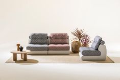 a living room filled with furniture on top of a rug