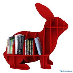 a red book shelf with books in the shape of a rabbit