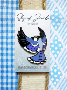 "A part of the songbird series for the 'Sky of Jewels' hard enamel pin series first found on Kickstarter, this Blue Jay hard enamel pin is a celebration of the beauty of the songbirds that are found in so many of our backyards! 2\" tall Nickel Black Finish Backer Card Double Rubber or Butterfly Clutch (Your choice!) Rubber Clutches: Good for hats, clothes, or any time a metal back might irritate your skin. Butterfly Metal Clutches: Good for bags, collars, and pin boards." Blue Enamel Collectible Pin, Collectible Blue Enamel Pin, Blue Enamel Pin For Gift, Blue Enamel Pins For Gifts, Blue Jay Bird, Lapel Brooch, Jay Bird, Bird Pins, Pin Art