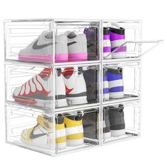 four tiered clear shoe rack with multiple pairs of shoes in each compartment on the bottom shelf