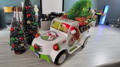 a toy car is decorated with christmas decorations