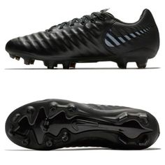 a pair of black soccer shoes on white background