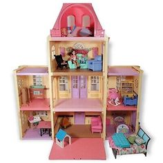 a doll house with furniture and accessories in it