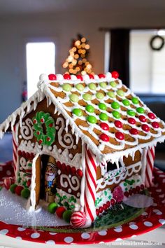 a gingerbread house is decorated with candy canes and candies for the holiday season