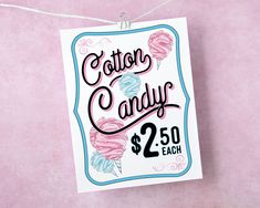 a sign that says cotton candy $ 2 50 each on pink paper with white string