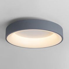 a circular light fixture on the wall