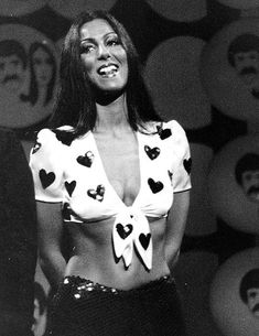 a woman in a top with hearts on it