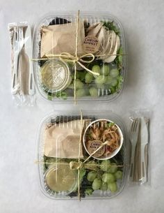 two plastic containers filled with food on top of a table