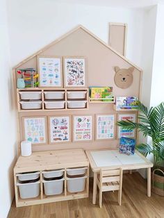 a child's playroom with toys and books on the shelves, including storage bins