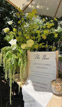 a table topped with flowers and a menu