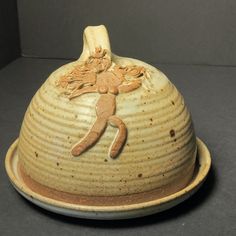 a brown and white ceramic bowl with an image of a person on the inside of it