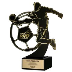 a trophy with a soccer player kicking a ball on it's back and the words pro in gold