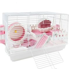 a white and pink hamster cage filled with toys