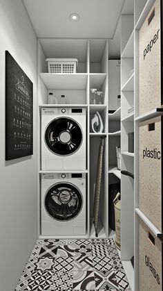 a washer and dryer in a room with black and white tiles on the floor