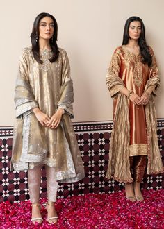 Include: 3 Piece - Top Bottom & Dupatta Fabric: Tissue Silk Style: Long Shirt Color: Golden Work Technique: Embellished Description: GUL is a perfect design to celebrate the winter weddings with its warm palette. Rusty orange zari tissue shirt is heavily embellished in gold on the front, back and sleeves. A crushed tissue organza dupatta and a maroon jamawar slim shalwar complement this outstanding design. Disclaimer: Actual product color may vary slightly from the image.