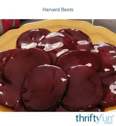 a yellow plate topped with chocolate covered donuts