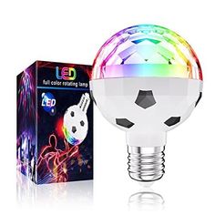 a colorful light bulb sitting next to a box on top of a white surface with an image of a soccer ball in it