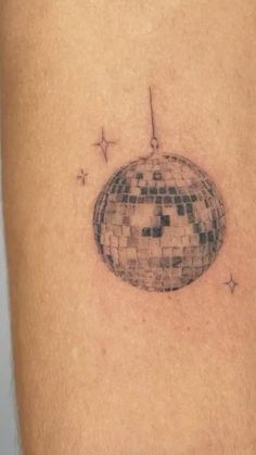 a tattoo with a disco ball on it