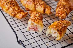 several pastries sitting on a cooling rack ready to be eaten