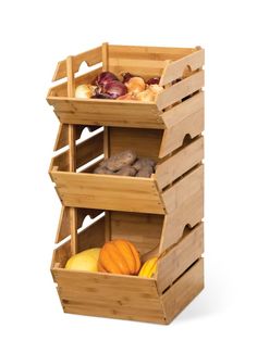 three wooden crates filled with different types of fruits and vegetables on top of each other