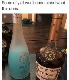 two bottles of alcohol sitting next to each other