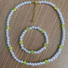 a necklace and bracelet with smiley faces on it